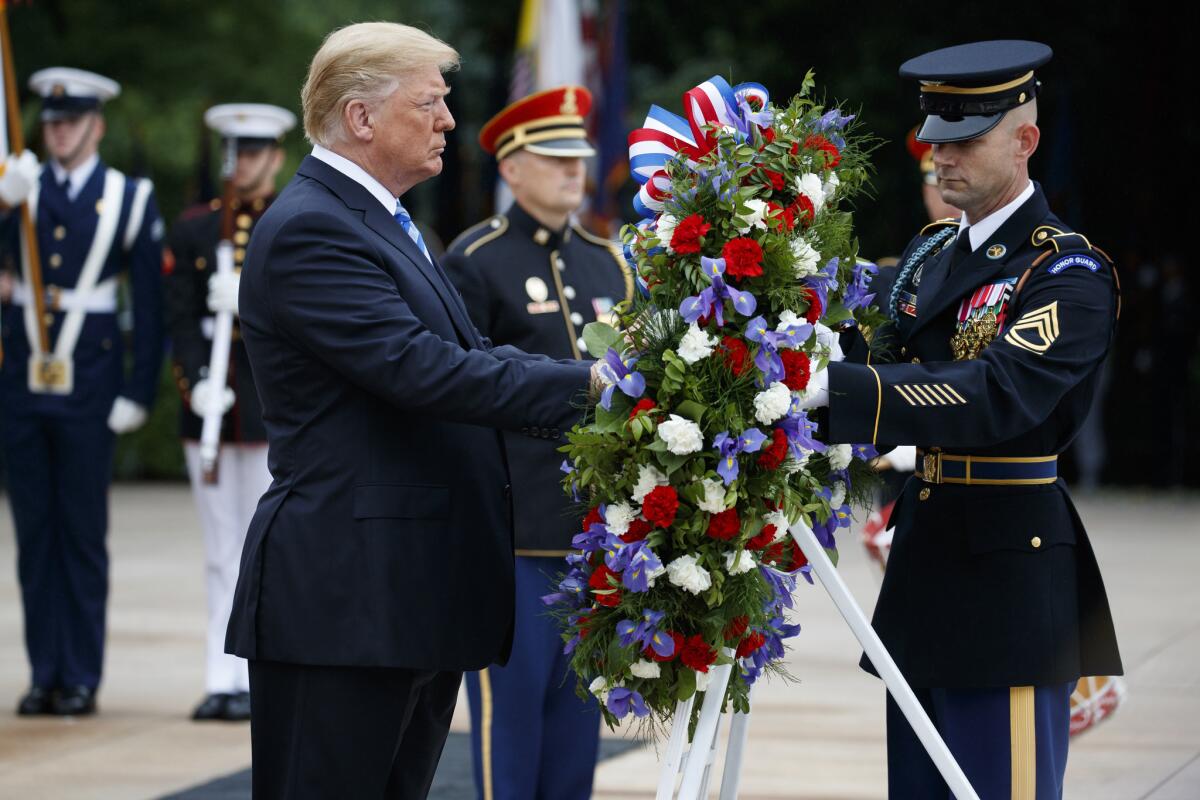 President Trump lays a wreath during a Memorial Day ceremony at Arlington National Cemetery.