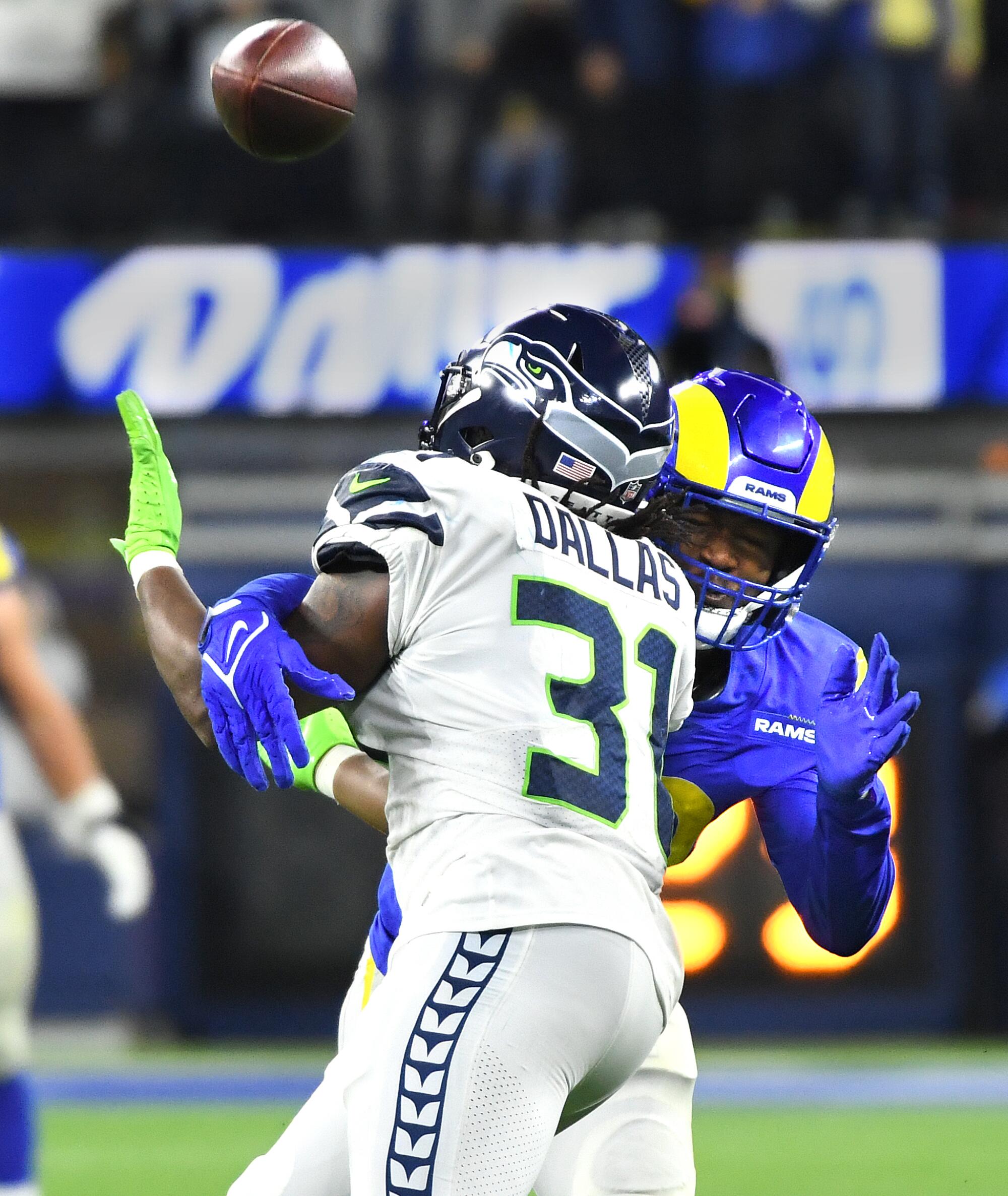 Rams linebacker Ernest Jones prevents Seahawks running back DeeJay Dallas from catching a pass.