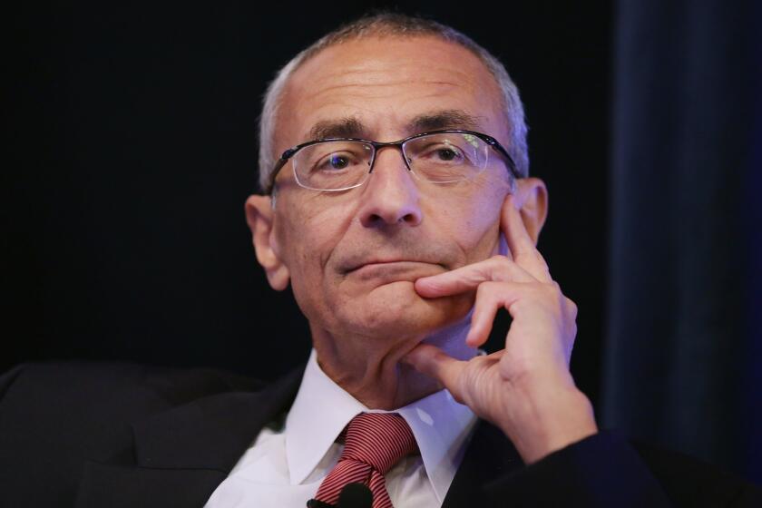 John Podesta moderates a panel during a conference commemorating the 10th anniversary of the Center for American Progress.