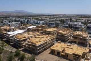 Irvine, CA - August 09: An aerial view of workers constructing new homes in Irvine on Monday, Aug. 9, 2021. (Allen J. Schaben / Los Angeles Times)