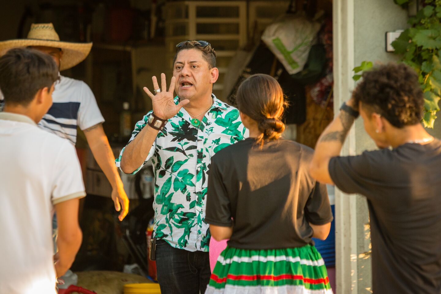 Gil Ramirez teaches dance to participants in an upcoming quinceañara.