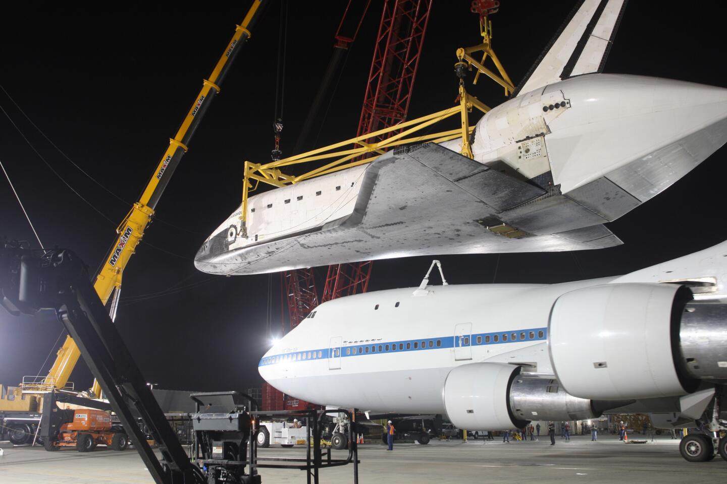 The retired space shuttle Endeavour is lifted off a NASA Boeing 747 transport plane at Los Angeles International Airport on its way to its final destination at the California Science Center on Sept. 22, 2012.
