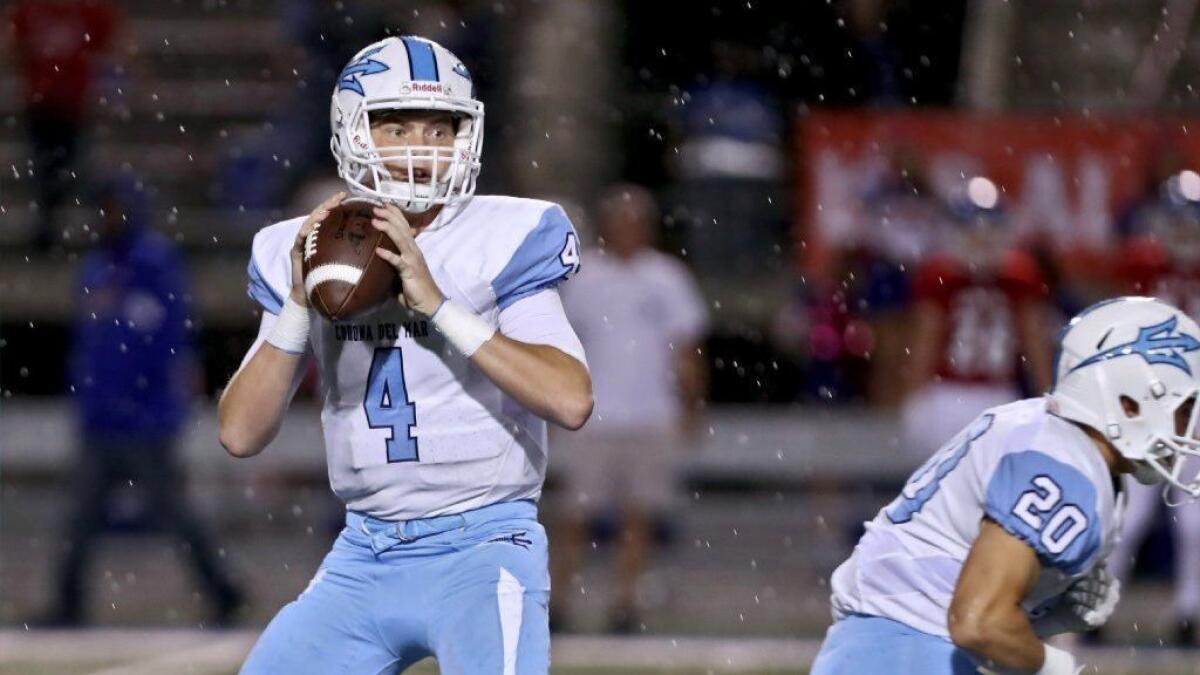 Corona del Mar High's Ethan Garbers, seen reading through progressions against Los Alamitos on Oct. 12, 2018, threw for 4,135 yards and 55 touchdowns last season.