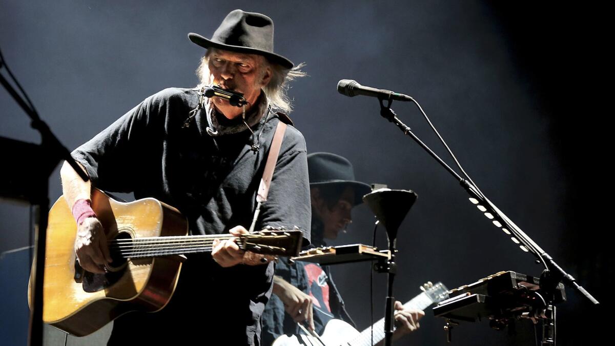 Veteran rocker Neil Young, shown performing in Indio in October at the Desert Trip rock festival, is releasing a new studio album, "Peace Trail," on Friday.