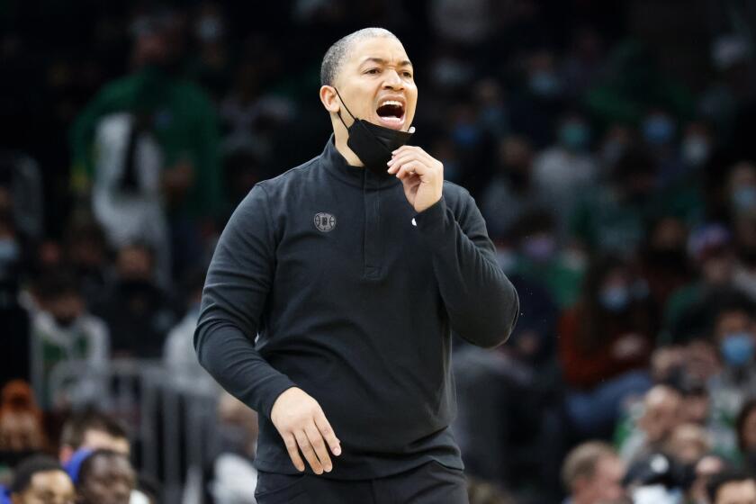 Los Angeles Clippers head coach Tyronn Lue yells to his team during the first half of an NBA basketball game against the Boston Celtics, Wednesday, Dec. 29, 2021, in Boston. (AP Photo/Mary Schwalm)