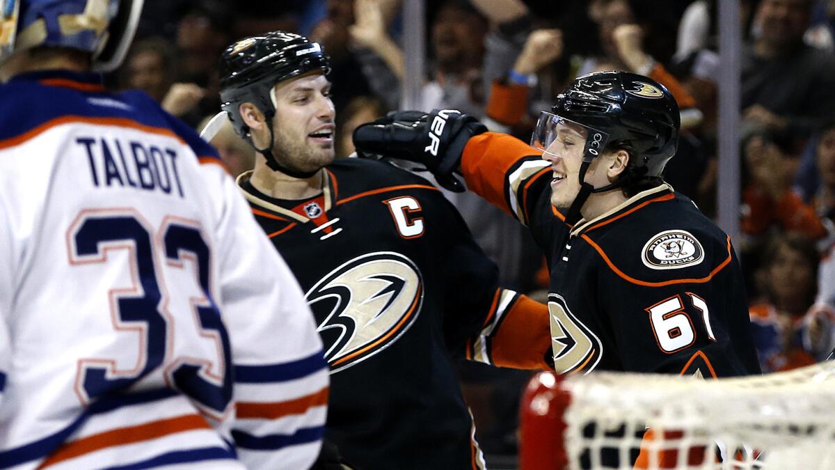 Ducks center Rickard Rakell (67) celebrates his goal with center Ryan Getzlaf during the second period of their game against the Oilers on Wednesday night at Honda Center.