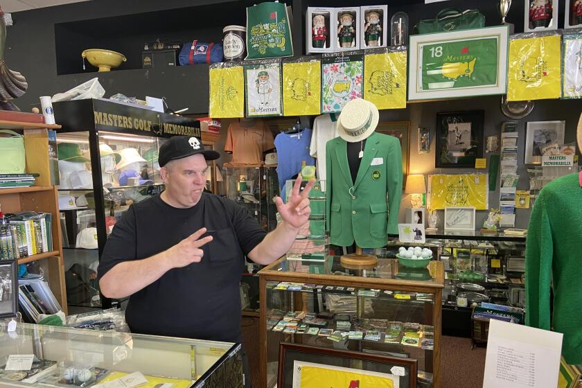 CJ Reading, a former chef at chain restaurants in Augusta, Ga., now sells Masters memorabilia at an antique shop down the street from Augusta National.