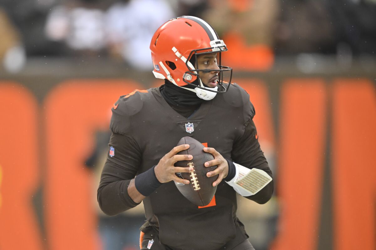 Cleveland Browns quarterback Deshaun Watson looks downfield during the first half of an NFL football game against the New Orleans Saints, Saturday, Dec. 24, 2022, in Cleveland. (AP Photo/David Richard)