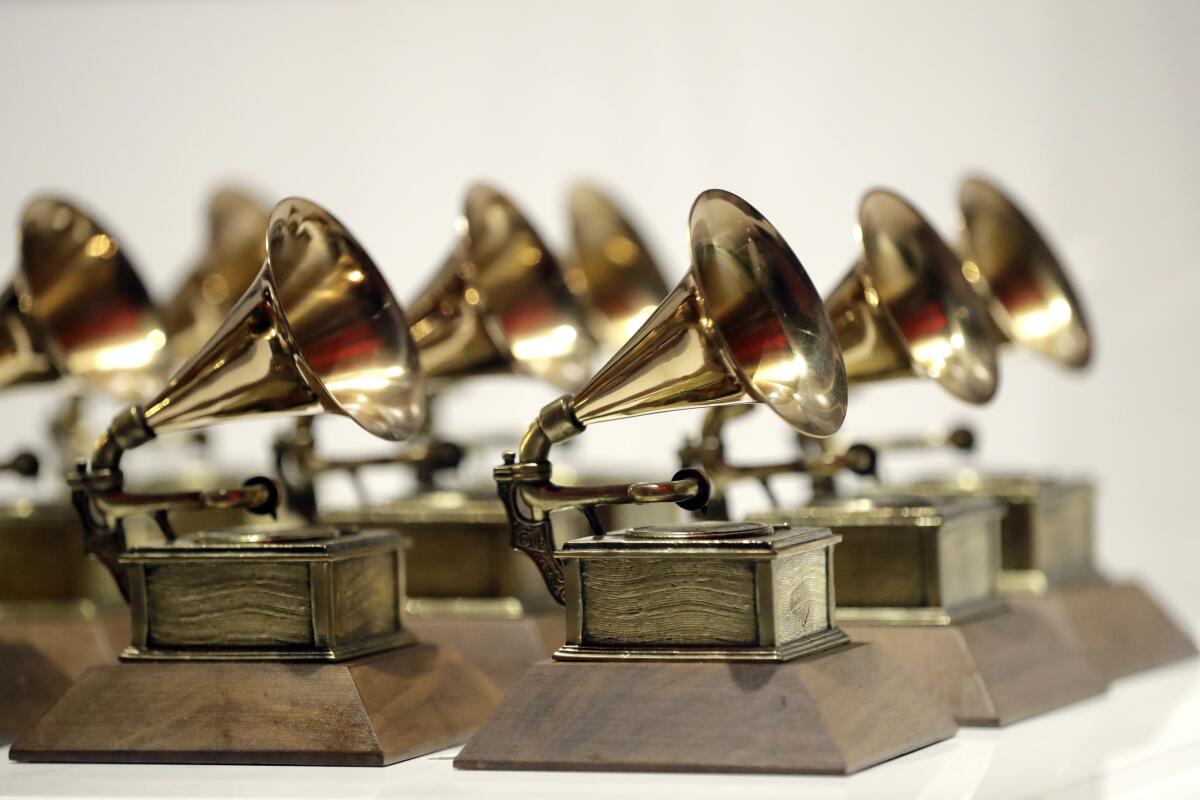 ARCHIVO - Los premios Grammy se exhiben en el Grammy Museum Experience 