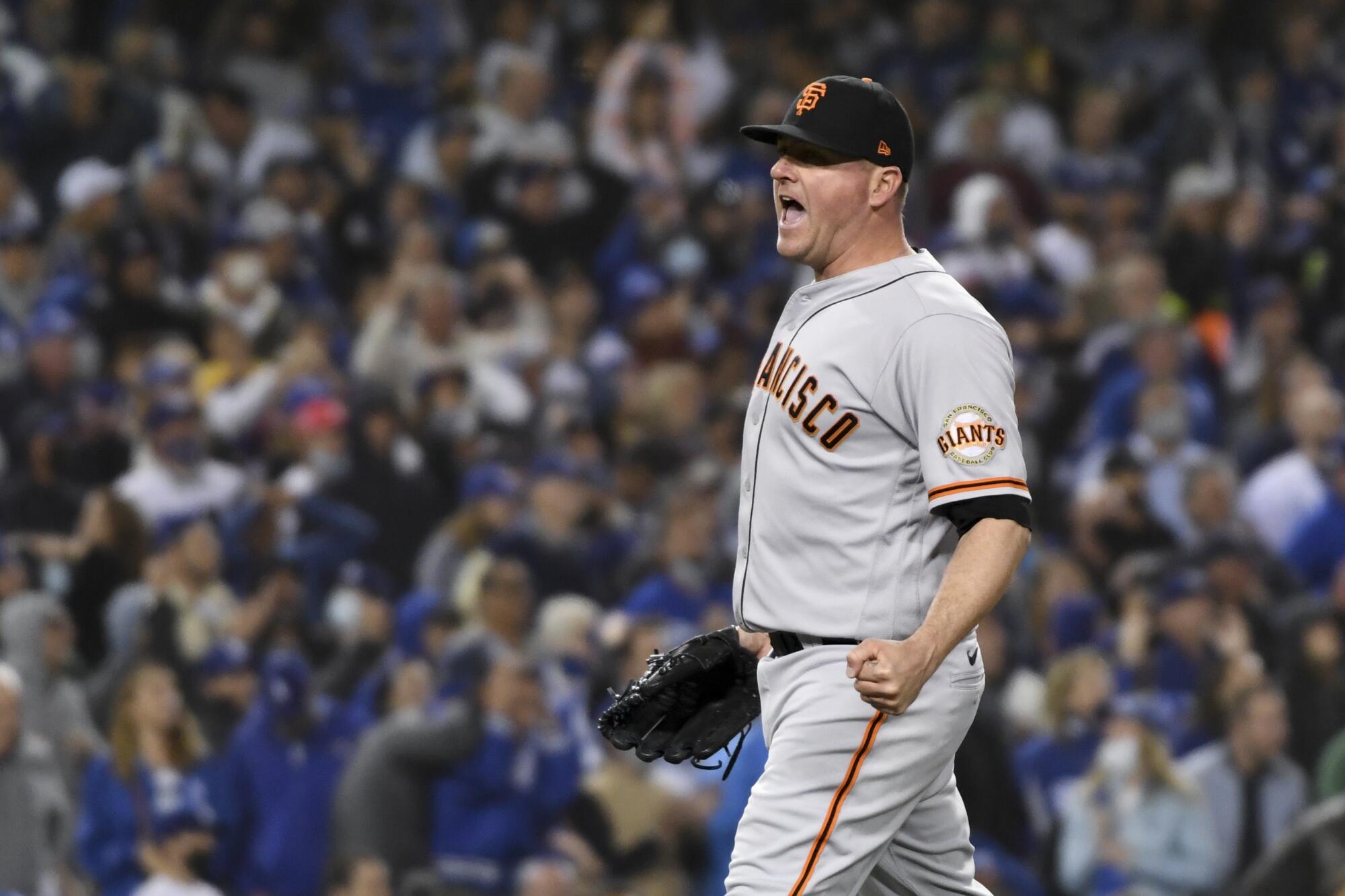 San Francisco Giants relief pitcher Jake McGee reacts after getting out of the seventh inning