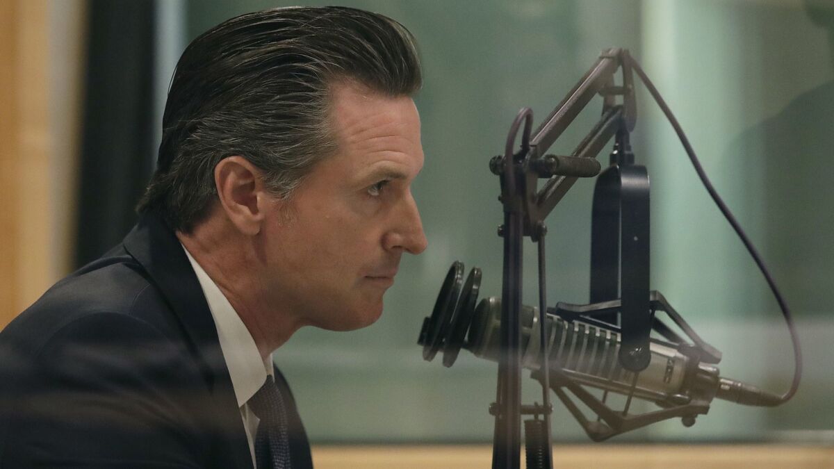 Democratic candidate Gavin Newsom listens to questions during a California gubernatorial debate with Republican candidate John Cox at KQED Public Radio Studio in San Francisco on Oct. 8.