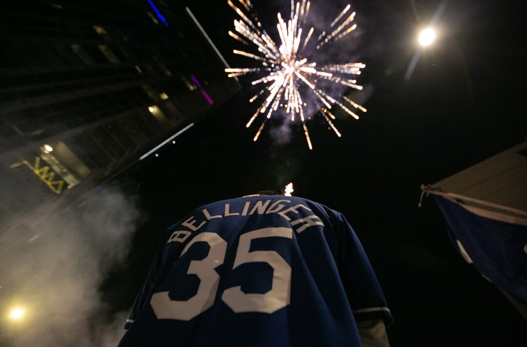 Fireworks explode in the sky as fans celebrate after the Los Angeles Dodgers won the World Series.