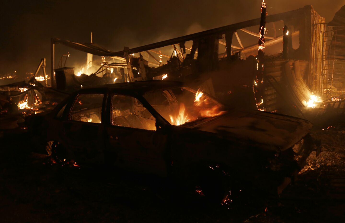 Burned homes and vehicles are left in the wake of the Blue Cut Fire that broke out in Devore near the Cajon Pass on Aug. 16, 2016.