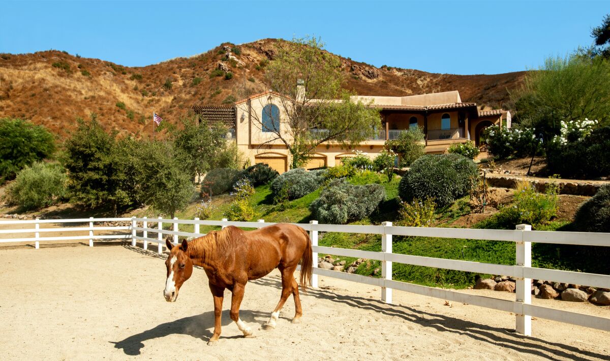 The Agoura Hills compound includes a main house, guesthouse, studio apartment, swimming pool and multiple riding arenas.