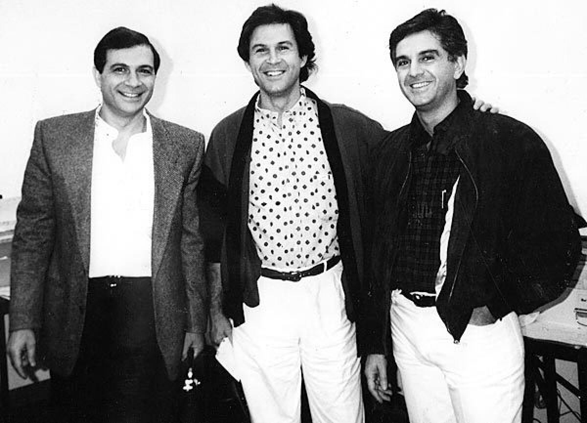 Armand, left, Georges and Maurice Marciano, circa 1988. The three brothers started Guess Inc. with brother Paul in Los Angeles in 1981.