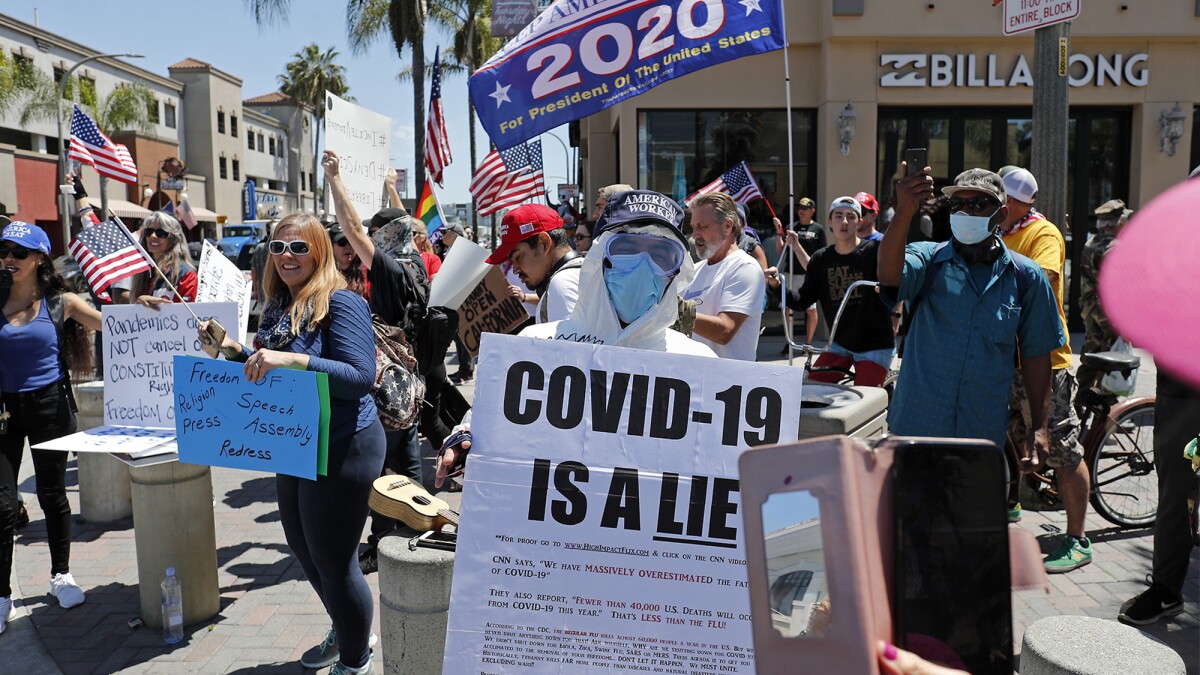 For protesters in Huntington Beach, social and economic restrictions are  political; COVID-19, a 'hoax' - Los Angeles Times