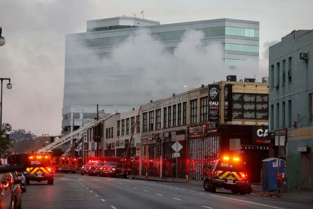 Firefighters battle the blaze resulting from an explosion in downtown L.A. on May 16.