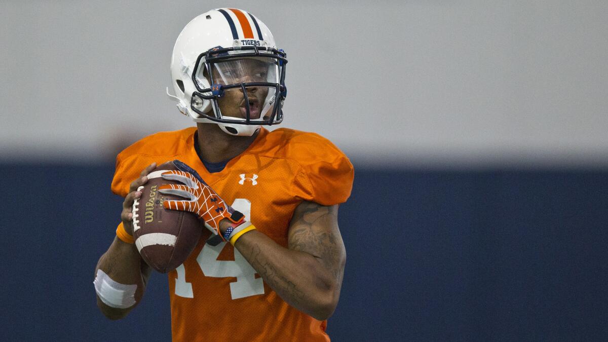 Auburn quarterback Nick Marshall drops back to pass during a pratice session on Aug. 5. Will the Tigers see a repeat of last year's success?