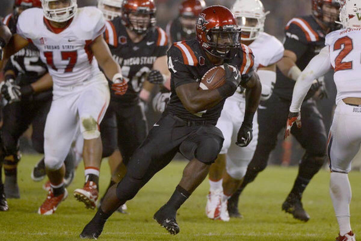 San Diego State's Adam Muema rushes for a touchdown against Fresno State in October.