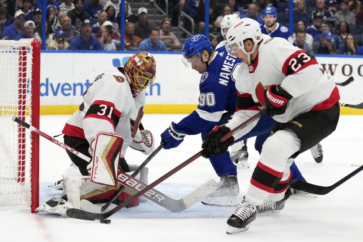 Ottawa Senators goaltender Anton Forsberg (31) makes a save on a shot by Tampa Bay Lightning center Vladislav Namestnikov (90) as -pot23n= clears away the puck during the second period of an NHL hockey game Tuesday, Nov. 1, 2022, in Tampa, Fla. (AP Photo/Chris O'Meara)
