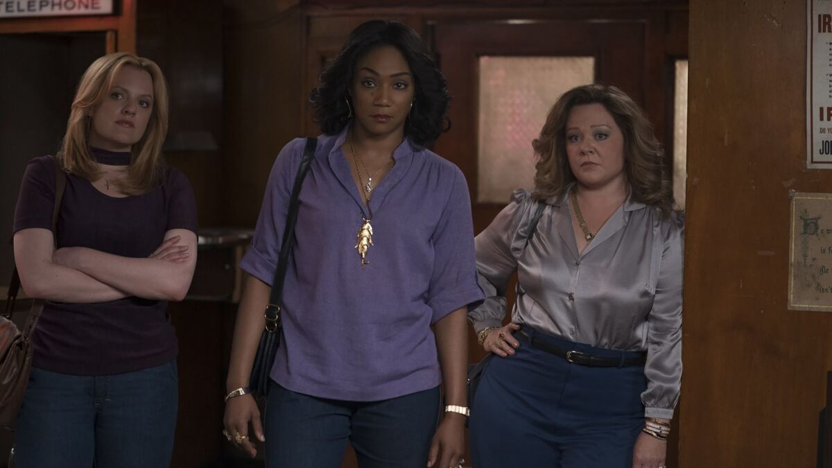 Elisabeth Moss as Claire, Tiffany Haddish as Ruby and Melissa McCarthy as Kathy in New Line Cinema's mob drama "The Kitchen."