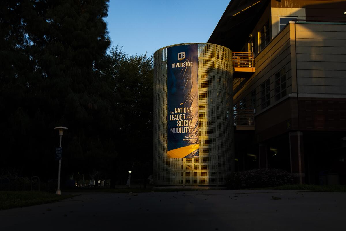A banner on a campus building with the UC Riverside name and the words "The nation's leader in social mobility"