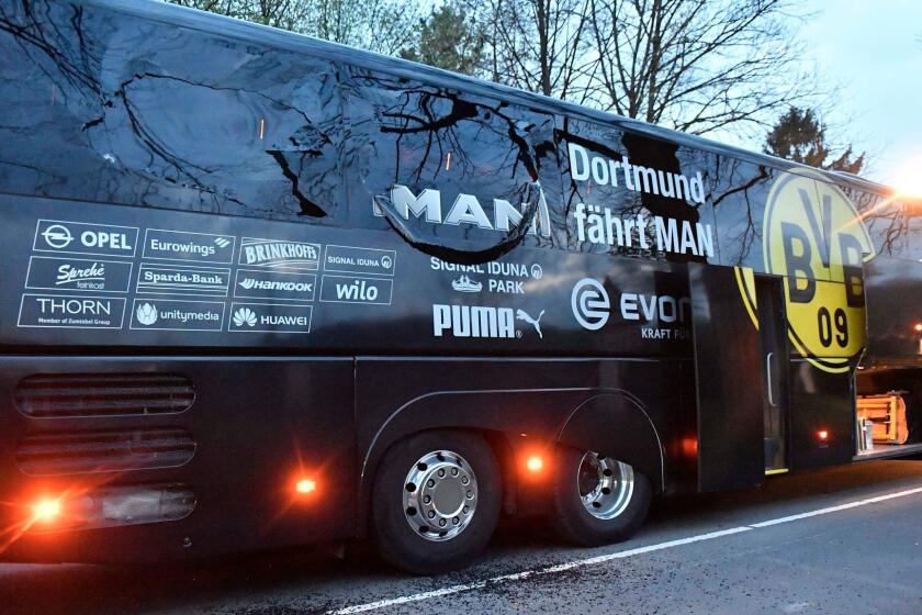 A window of Dortmund's team bus is damaged after an explosion before the Champions League quarterfinal soccer match between Borussia Dortmund and AS Monaco in Dortmund, western Germany, Tuesday, April 11, 2017. (AP Photo/Martin Meissner)