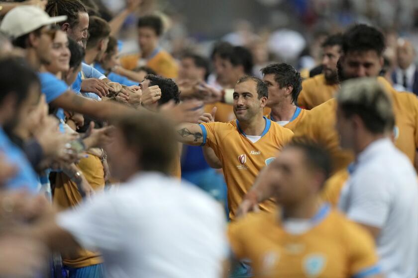 Uruguay's players greets supporters after the Rugby World Cup Pool A match between Italy and Uruguay at the Stade de Nice, in Nice, Wednesday, Sept. 20, 2023. (AP Photo/Pavel Golovkin)