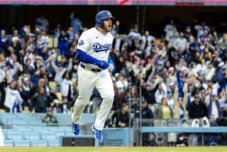 LOS ANGELES, CA - MARCH 31, 2024: Los Angeles Dodgers third baseman Max Muncy (13) leaps.