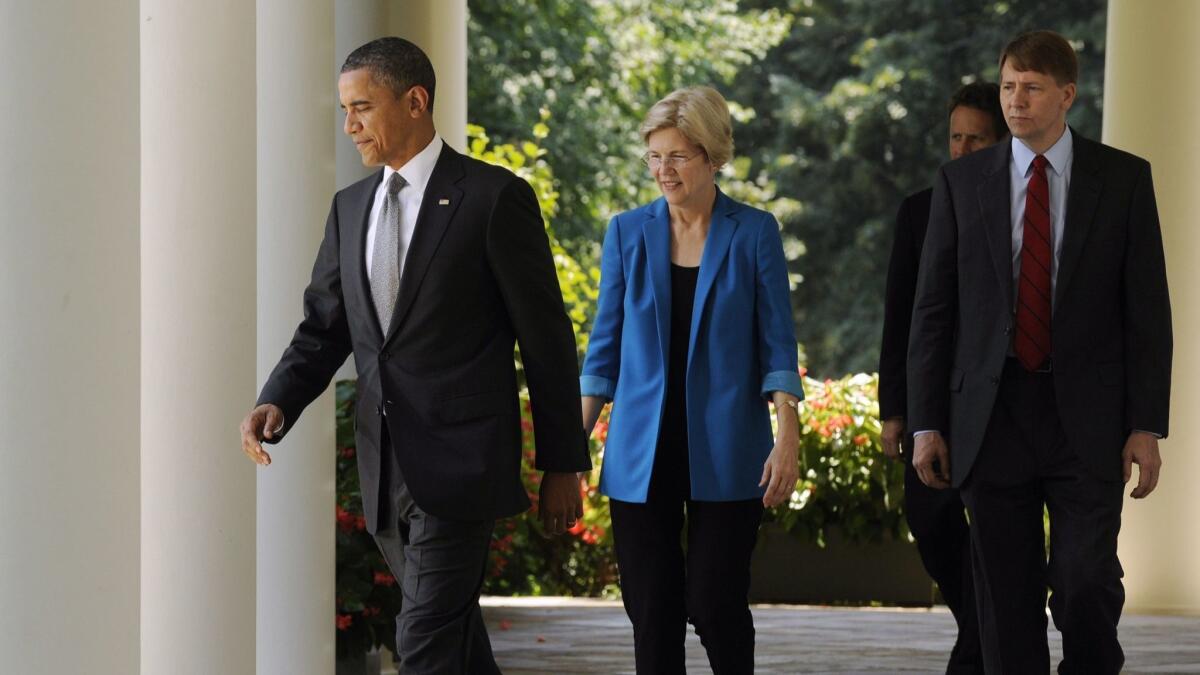 Then-President Obama leads Elizabeth Warren and Richard Cordray to the White House Rose Garden in 2011 to announce Cordray's nomination to be the first director of the Consumer Financial Protection Bureau