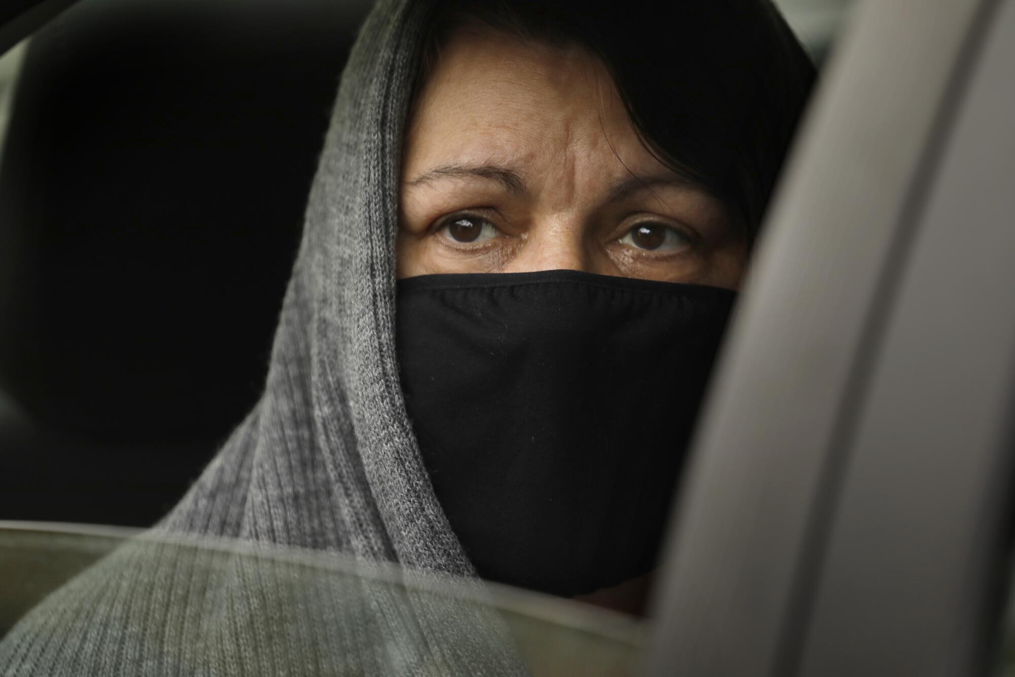 Maureena Silva attends the funeral of her mother, Wanda DeSelle. She was not allowed to get out of her car at the cemetery or see her mother in the hospital when she was gravely ill.