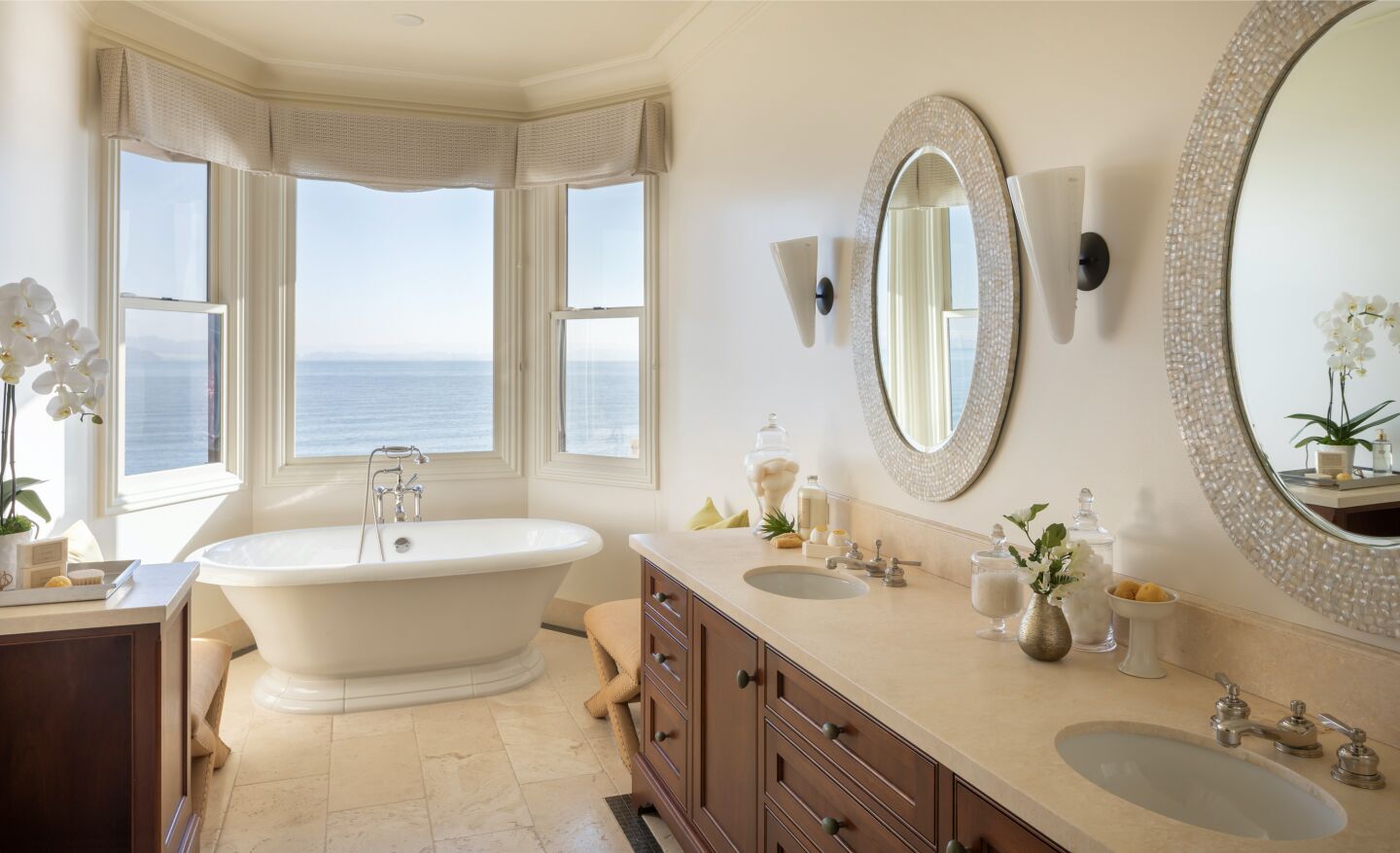 The bathroom with windows overlooking the bay.
