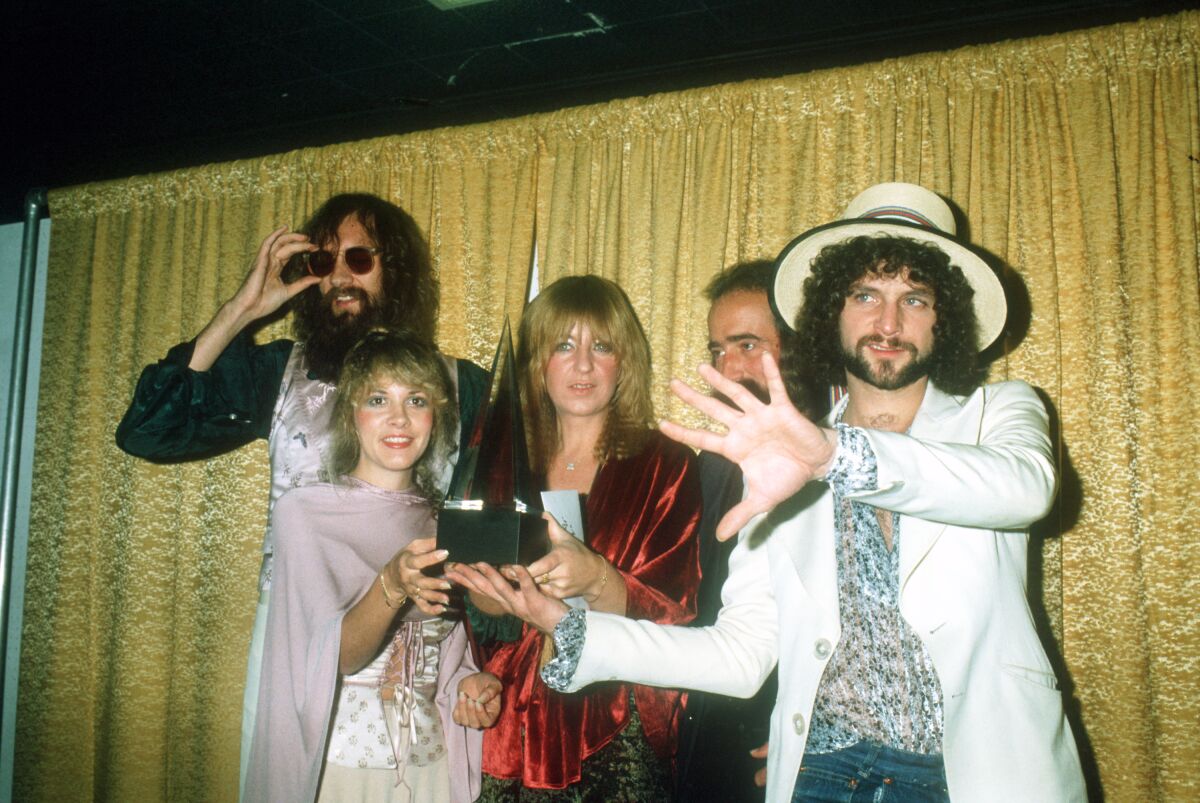 Fleetwood Mac hold an award in 1978.
