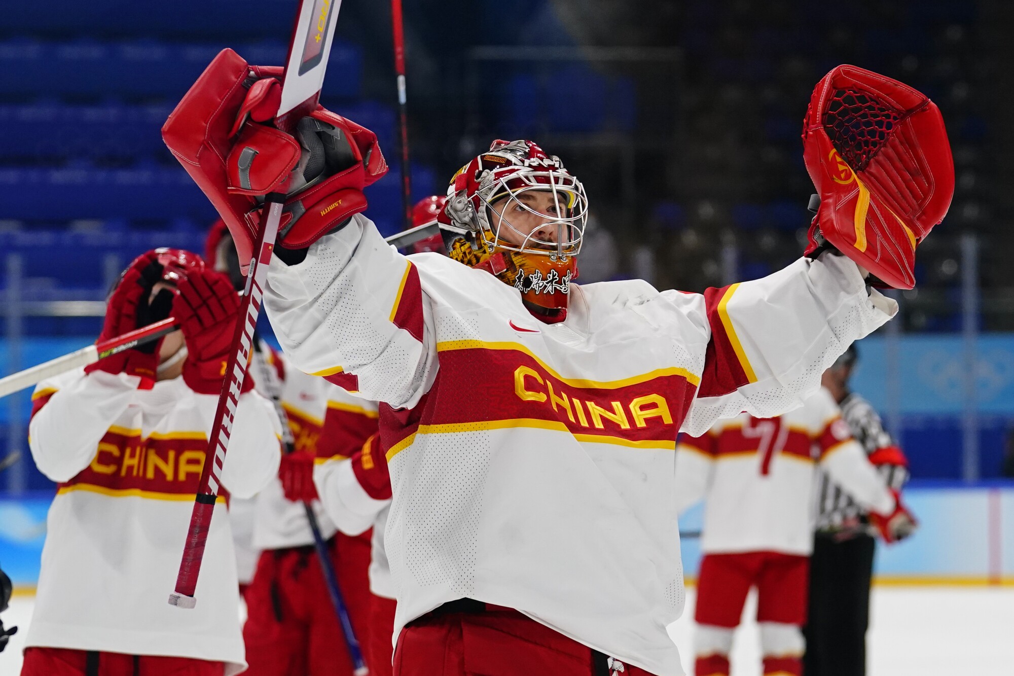 China goalkeeper Jieruimi Shimisi (Jeremy Smith) waves to fans after a match against Germany on Saturday.