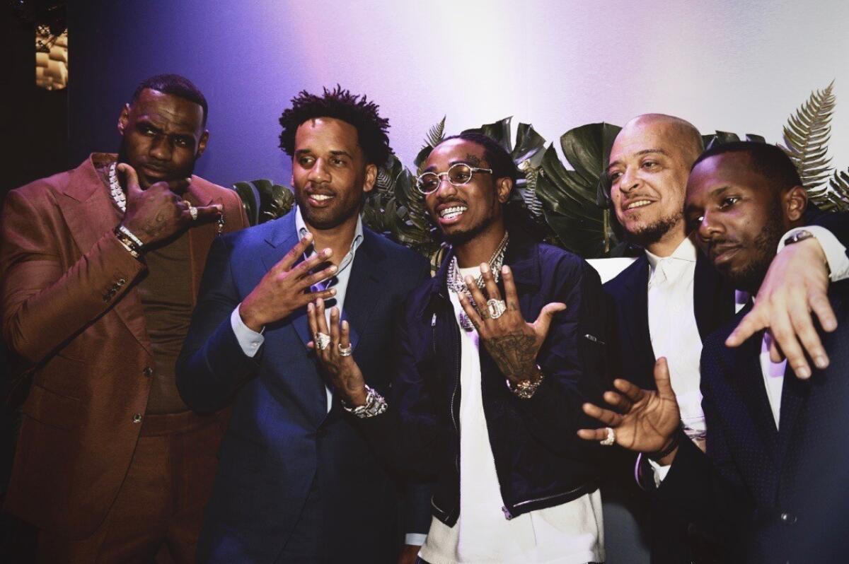 From left, LeBron James, Maverick Carter, rapper Quavo, Paul Rivera (writer for James' HBO interview show "The Shop") and Klutch Sports Group founder and SpringHill partner Rich Paul at the Klutch 2019 All Star Weekend dinner February 16, 2019 in Charlotte, North Carolina.