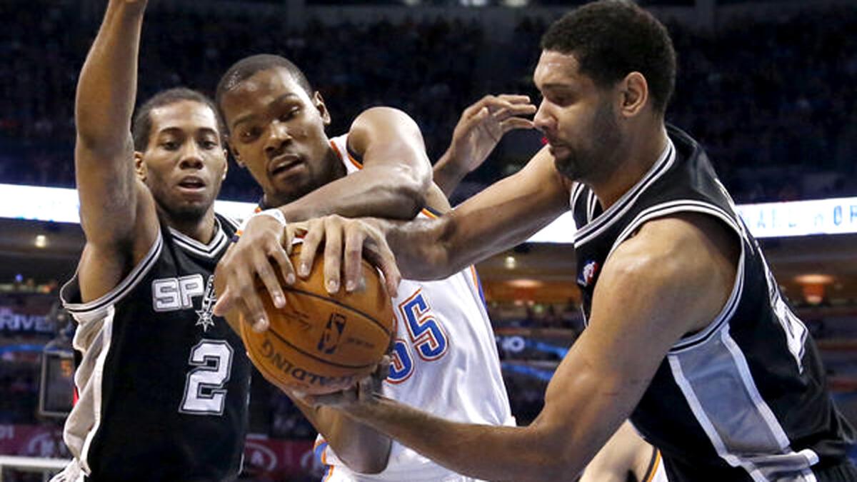 Forward Kevin Durant (35) and the Thunder will have their hands full against forward Kawhi Leonard (2), Tim Duncan and the Spurs when the Western Conference semifinals begin on Saturday.