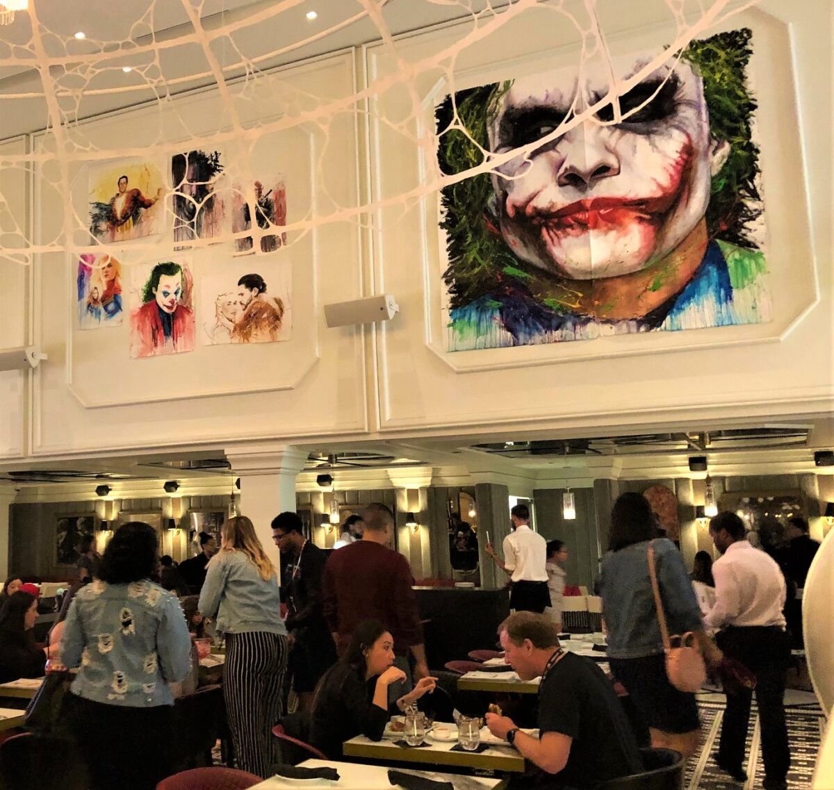 Many downtown businesses have gotten into the spirit of Comic-Con. The Joker surveys a crowd of diners at the Sugar Factory American Brasserie on the ground floor of the Theatre Box, where some private Comic-Con screenings and parties were scheduled.