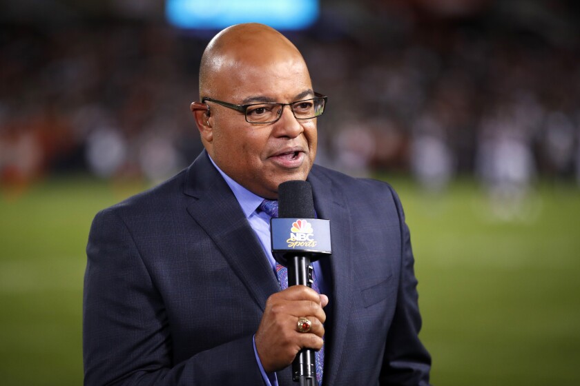 FILE - In this Sept. 5, 2019, file photo, NBC sportscaster Mike Tirico works the sidelines during an NFL football game between the Green Bay Packers and the Chicago Bears in Chicago. Tirico is about to give new meaning to double duty when NBC broadcasts the Olympics and Super Bowl next month. Tirico will anchor the network’s primetime coverage of the Beijing Games, but will also host the Super Bowl pregame show from Los Angeles on Feb. 13 2022. (AP Photo/Jeff Haynes, File)