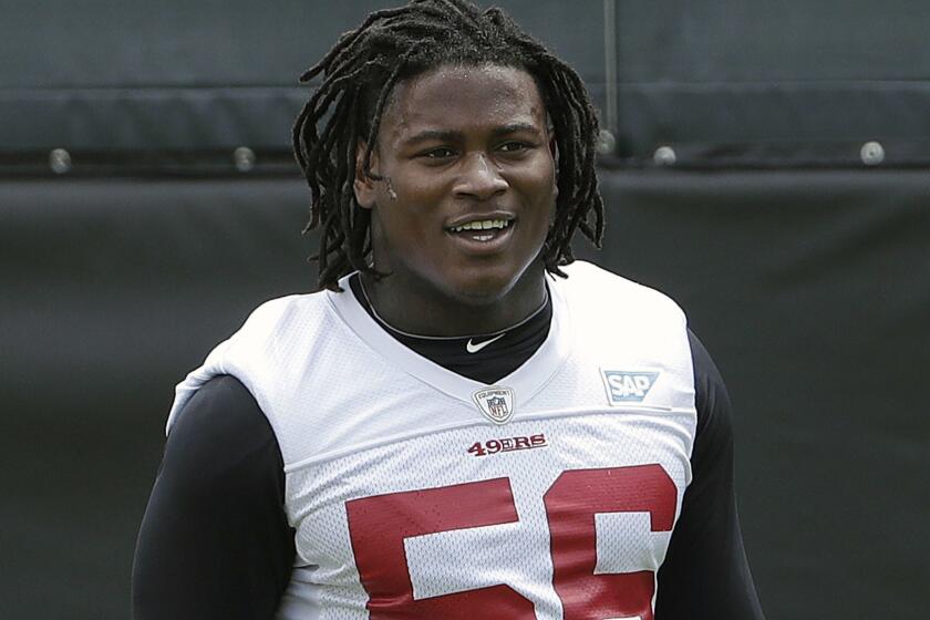 FILE - In this May 30, 2018, file photo, San Francisco 49ers linebacker Reuben Foster walks on the field during a practice at the team's NFL football training facility in Santa Clara, Calif. Foster was arrested Saturday, Nov. 24, at the team hotel on charges of domestic violence. (AP Photo/Jeff Chiu, File)