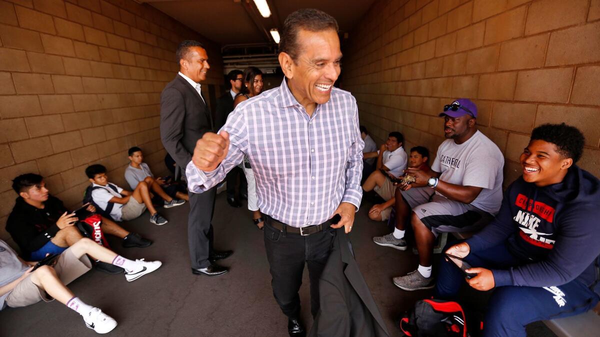 Villaraigosa gives a pep talk to students where he played football as a student at Cathedral High School, where he was kicked out for fighting and poor grades decades ago.