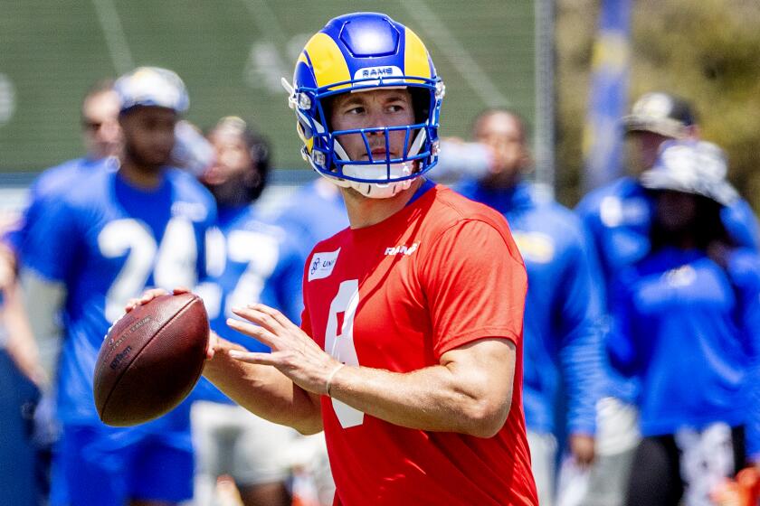 IRVNE, CA - JULY 24, 2022: Rams quarterback Matthew Stafford looks to pass during training camp.