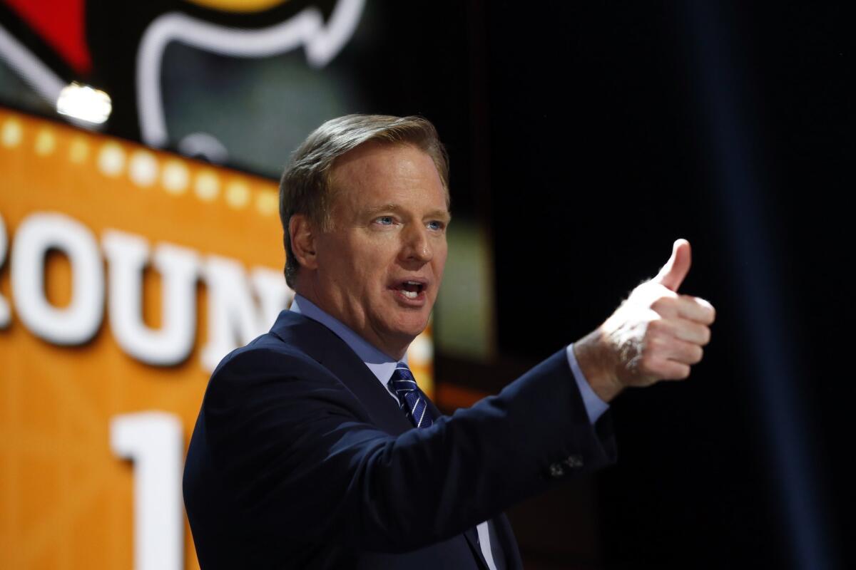 NFL Commissioner Roger Goodell acknowledges fans during the first round of the NFL draft Thursday in Chicago.