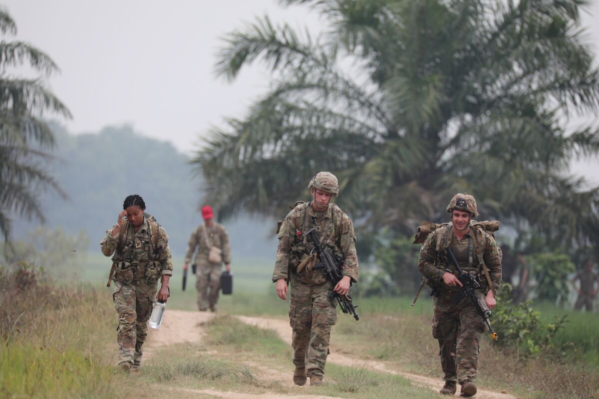 U.S. soldiers walk during annual joint combat exercises in Baturaja, South Sumatra province, Indonesia, Wednesday, Aug 3, 2022. The United States and Indonesian militaries began annual joint combat exercises Wednesday on Indonesia's Sumatra island, joined for the first time by partner nations, signaling stronger ties amid growing maritime activity by China in the Indo-Pacific region. (AP Photo)