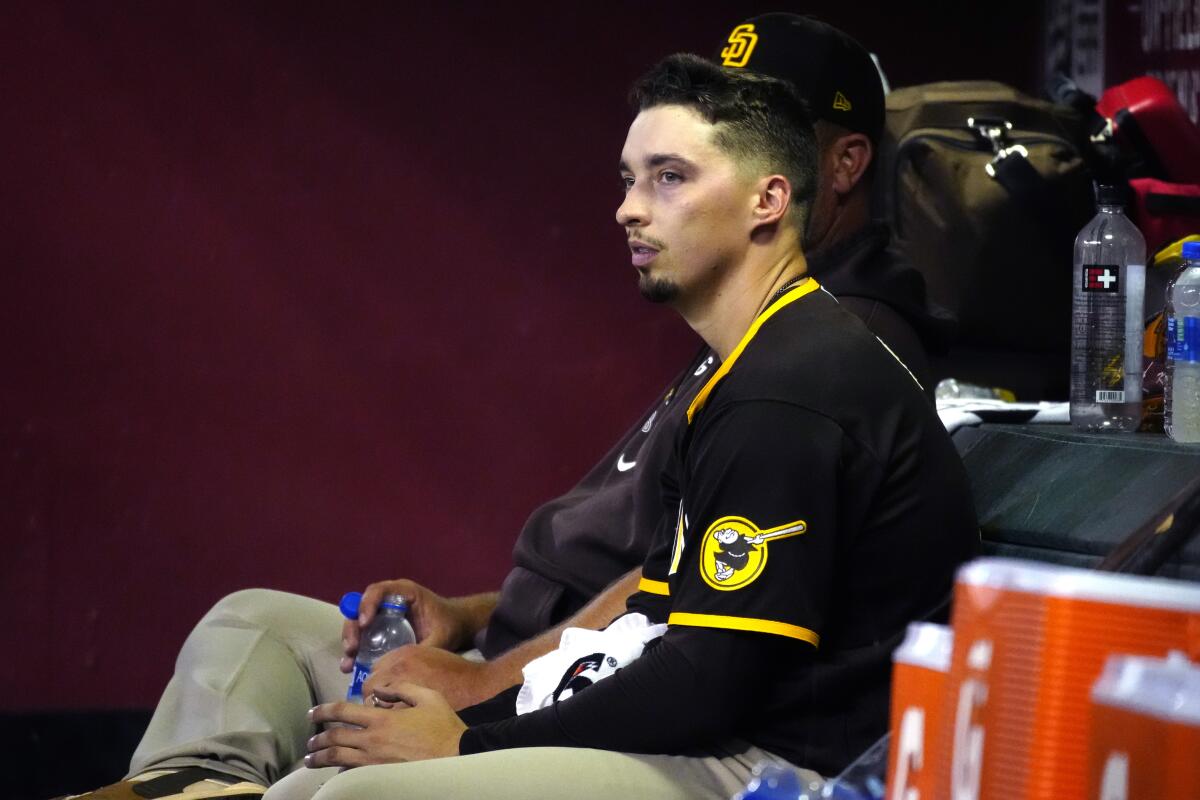 Blake Snell sits in the dugout after throwing seven hitless innings 