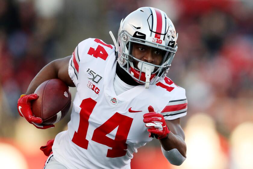 PISCATAWAY, NEW JERSEY - NOVEMBER 16: K.J. Hill #14 of the Ohio State Buckeyes carries the ball in the first quarter against the Rutgers Scarlet Knights at SHI Stadium on November 16, 2019 in Piscataway, New Jersey. (Photo by Elsa/Getty Images)