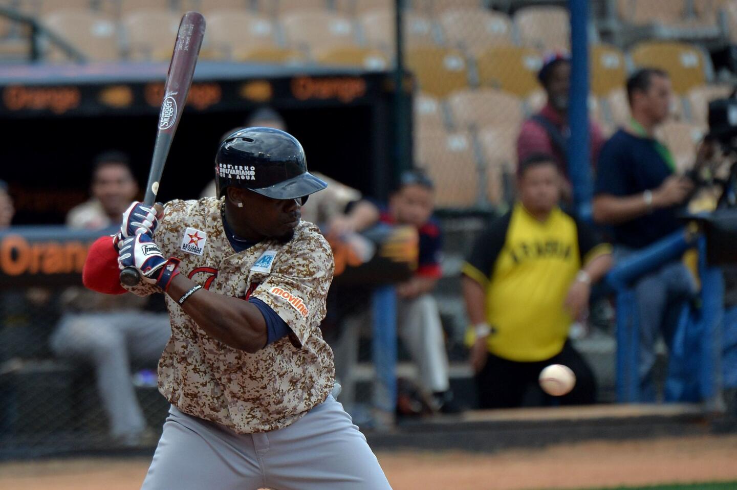 Adonis Garcia of Venezuela hits against Cuba during their 2016 Caribbean Baseball Series game in Santo Domingo, Dominican Republic, on February 4, 2016. AFP PHOTO/YAMIL LAGEYAMIL LAGE/AFP/Getty Images ** OUTS - ELSENT, FPG, CM - OUTS * NM, PH, VA if sourced by CT, LA or MoD **