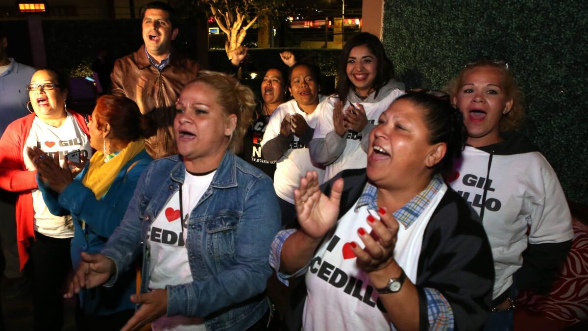 Supporters of City Councilman Gil Cedillo celebrate during his election night party. Cedillo easily beat his opponent, Joe Bray-Ali, with 70.8% of the vote.