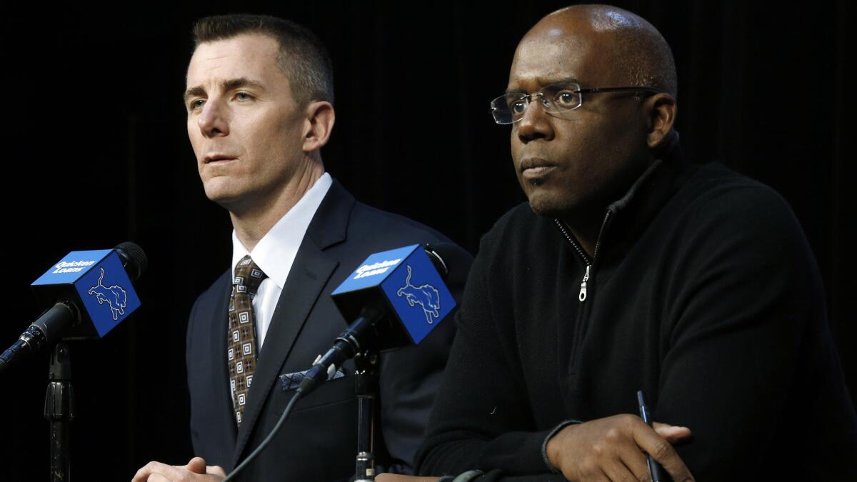 Tom Lewand, left, and Martin Mayhew address reporters during a news conference on Dec. 30, 2013.