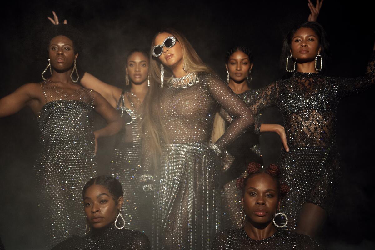 Beyoncé and backup performers, in glittery costumes, for "Find Your Way Back." 