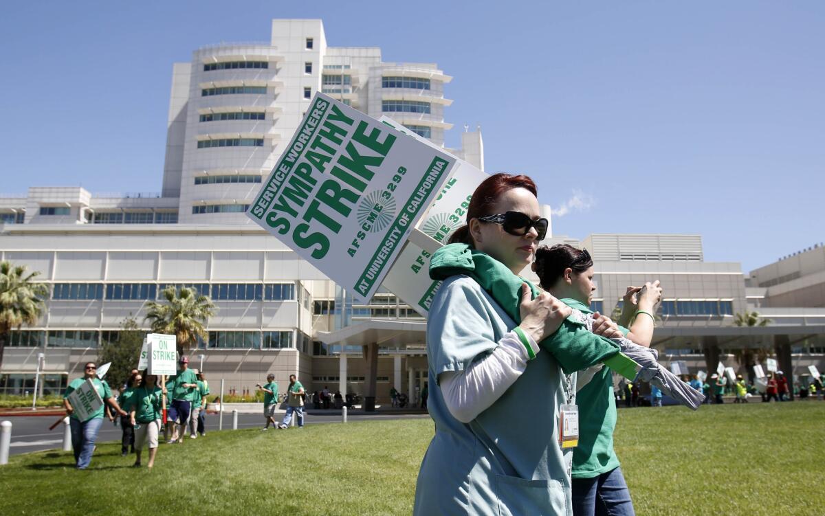Shannon Hartman, a medical assistant, joined others picketing Tuesday at UC Davis Medical Center in Sacramento.